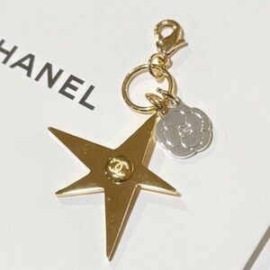 CHANEL Holiday Gold Star Pendant with Silver Camellia Flower Accent New